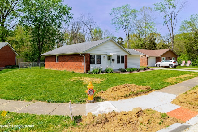 215 Bottorff Dr, Sellersburg, IN 47172 - ranch-style house featuring brick siding, a front yard, and fence