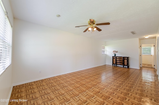 215 Bottorff Dr, Sellersburg, IN 47172 - unfurnished room with baseboards, a ceiling fan, a textured ceiling, and visible vents