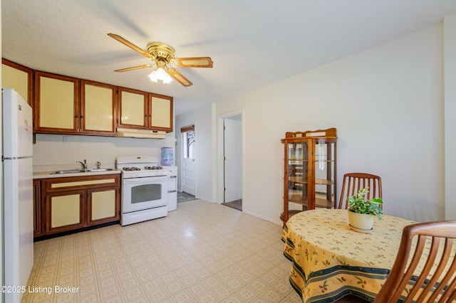 215 Bottorff Dr, Sellersburg, IN 47172 - kitchen featuring a sink, white appliances, ceiling fan, light countertops, and under cabinet range hood