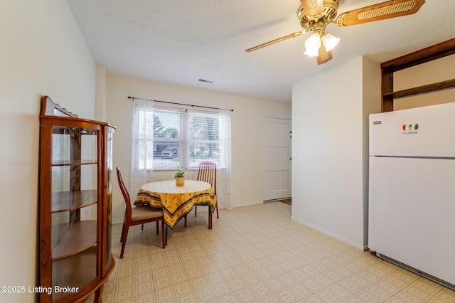 215 Bottorff Dr, Sellersburg, IN 47172 - dining space featuring light floors, baseboards, a ceiling fan, and visible vents