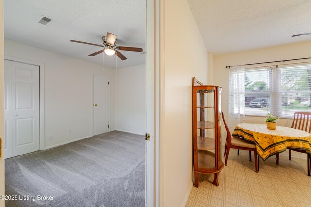 215 Bottorff Dr, Sellersburg, IN 47172 - interior space with a textured ceiling, visible vents, a ceiling fan, and baseboards