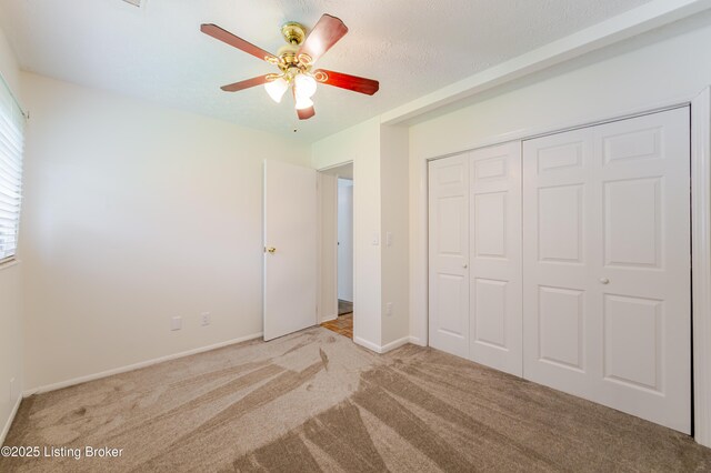 215 Bottorff Dr, Sellersburg, IN 47172 - unfurnished bedroom featuring a ceiling fan, baseboards, carpet, and a closet