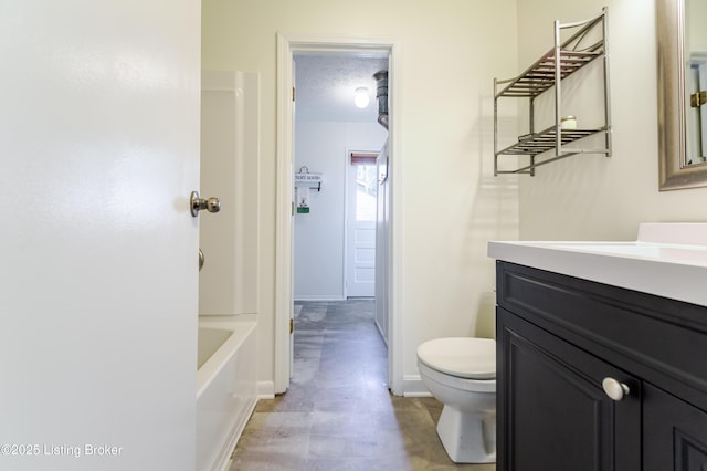 215 Bottorff Dr, Sellersburg, IN 47172 - bathroom with baseboards, a textured ceiling, toilet, and vanity