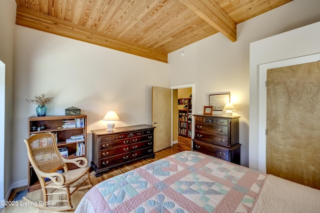 bedroom featuring wood ceiling, beam ceiling, and wood finished floors