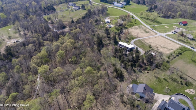 drone / aerial view featuring a forest view