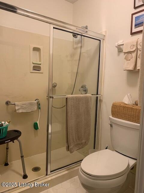 325 Rosewood Dr, Louisville, KY 40223 - full bathroom with a shower stall, toilet, and tile patterned floors
