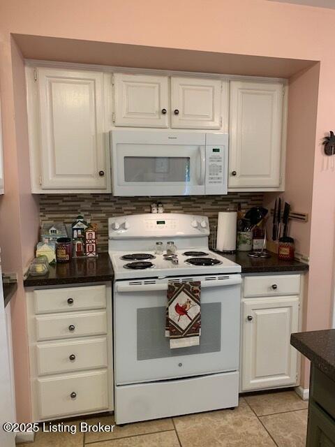 325 Rosewood Dr, Louisville, KY 40223 - kitchen with white appliances, white cabinets, light tile patterned floors, and tasteful backsplash