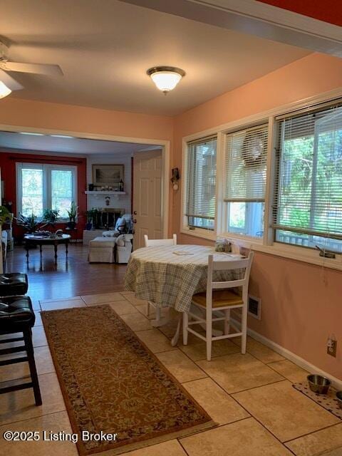 325 Rosewood Dr, Louisville, KY 40223 - dining area featuring healthy amount of natural light, light tile patterned floors, and ceiling fan