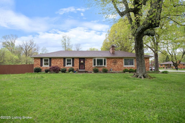 ranch-style home with fence, a front lawn, and brick siding