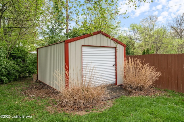 view of shed featuring fence