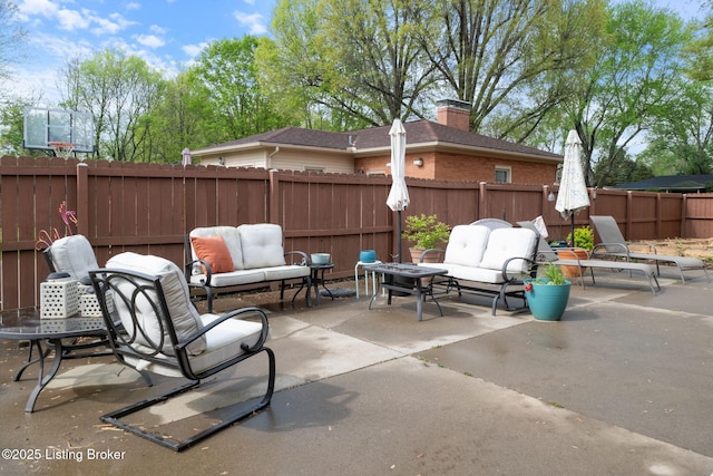 view of patio / terrace with outdoor lounge area and a fenced backyard