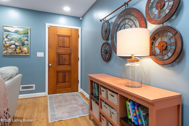 entrance foyer with recessed lighting, wood finished floors, visible vents, and baseboards