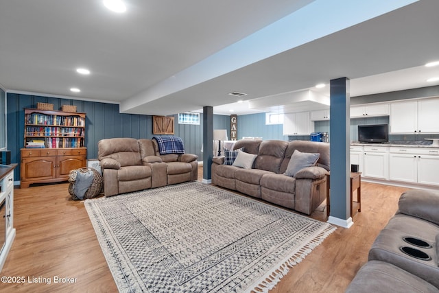 living room featuring visible vents, recessed lighting, and light wood-style floors