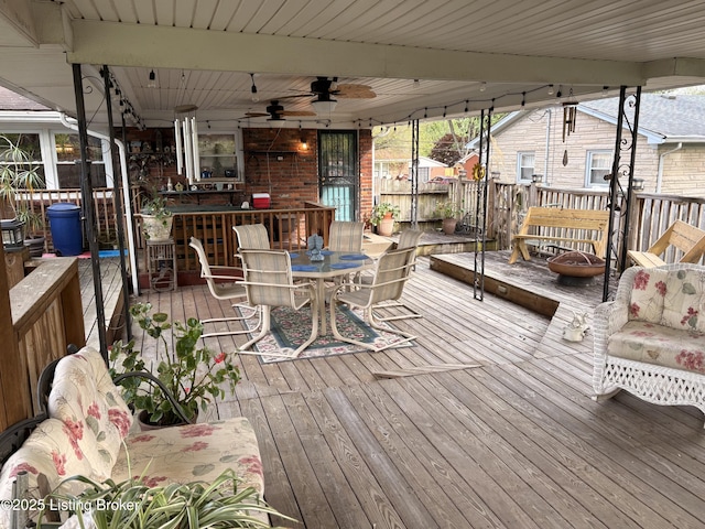 deck with a ceiling fan and outdoor dining area