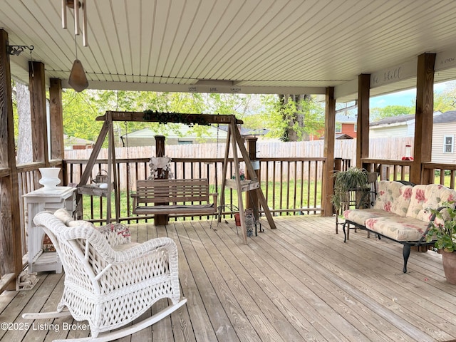 deck with a fenced backyard