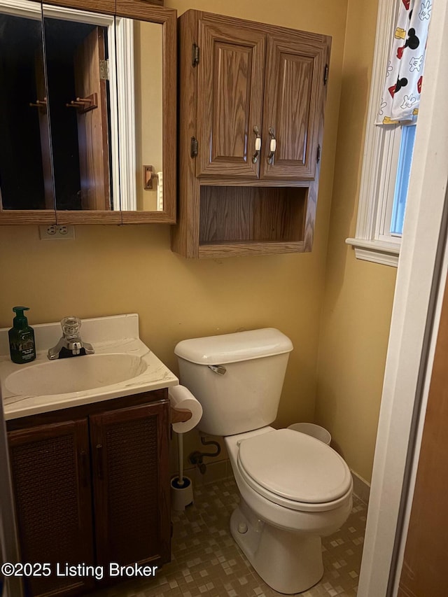 10210 Eve Dr, Louisville, KY 40272 - bathroom with toilet, vanity, baseboards, and tile patterned flooring