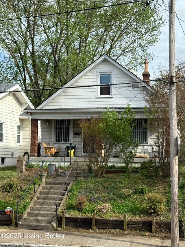 view of front of property featuring covered porch