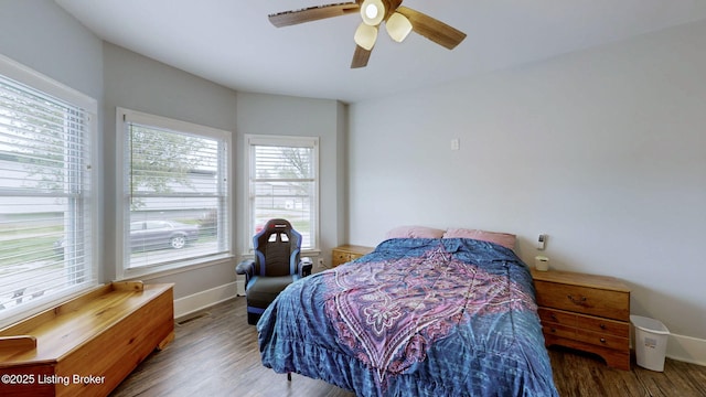 702 11th St, Carrollton, KY 41008 - bedroom featuring wood finished floors, visible vents, baseboards, and ceiling fan