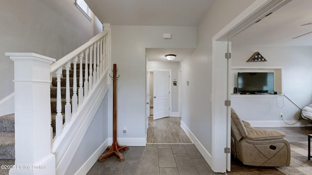 702 11th St, Carrollton, KY 41008 - staircase featuring tile patterned flooring and baseboards