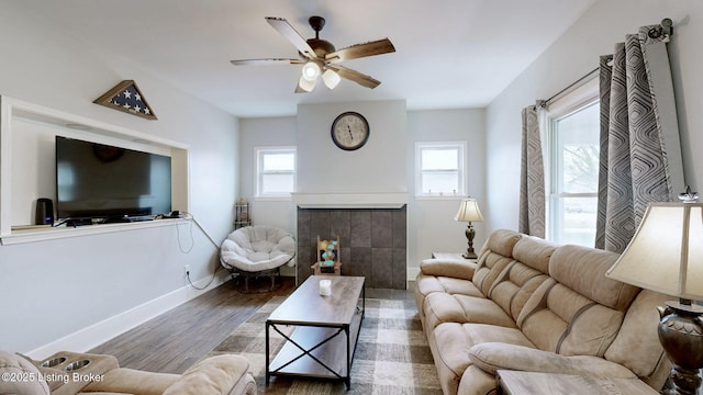 702 11th St, Carrollton, KY 41008 - living room with a ceiling fan, a healthy amount of sunlight, wood finished floors, and a tiled fireplace