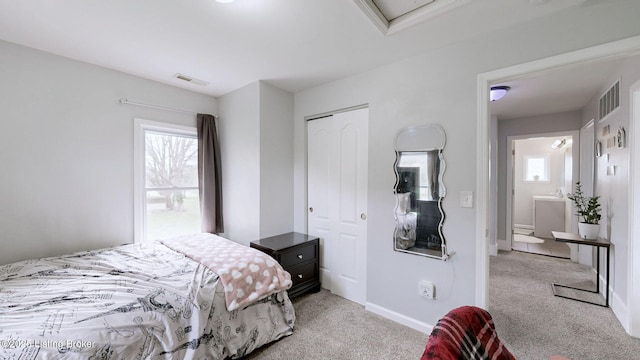 702 11th St, Carrollton, KY 41008 - carpeted bedroom with a closet, visible vents, and multiple windows