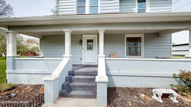 702 11th St, Carrollton, KY 41008 - view of exterior entry with covered porch