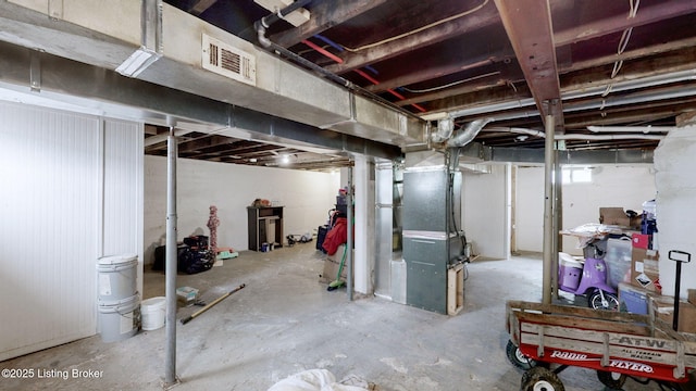 702 11th St, Carrollton, KY 41008 - unfinished below grade area featuring heating unit and visible vents