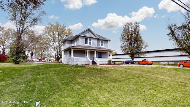 702 11th St, Carrollton, KY 41008 - view of front of house featuring a porch and a front lawn