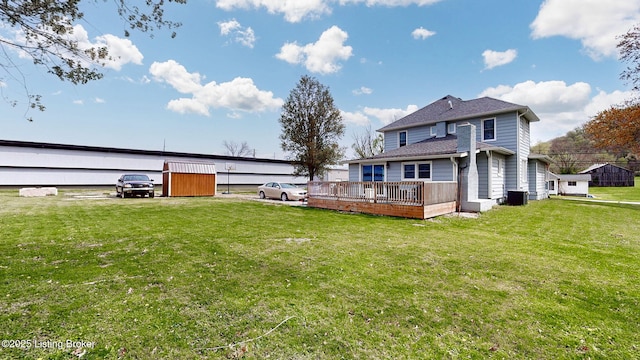 702 11th St, Carrollton, KY 41008 - rear view of property featuring a yard, a wooden deck, and central AC unit