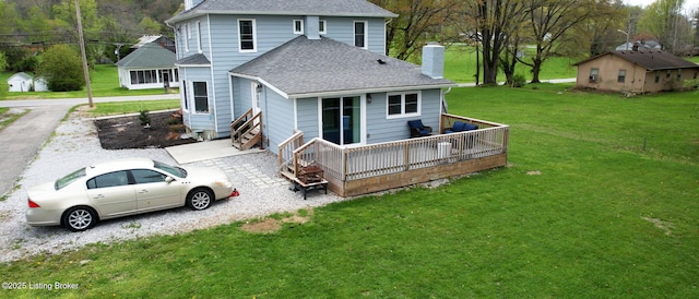 702 11th St, Carrollton, KY 41008 - rear view of house with a wooden deck, a lawn, a shingled roof, and a chimney