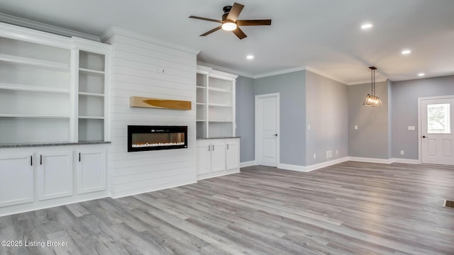 unfurnished living room with crown molding, light wood-type flooring, ceiling fan, baseboards, and recessed lighting