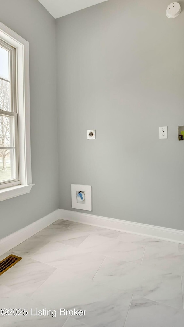 laundry room with plenty of natural light, laundry area, visible vents, hookup for an electric dryer, and baseboards