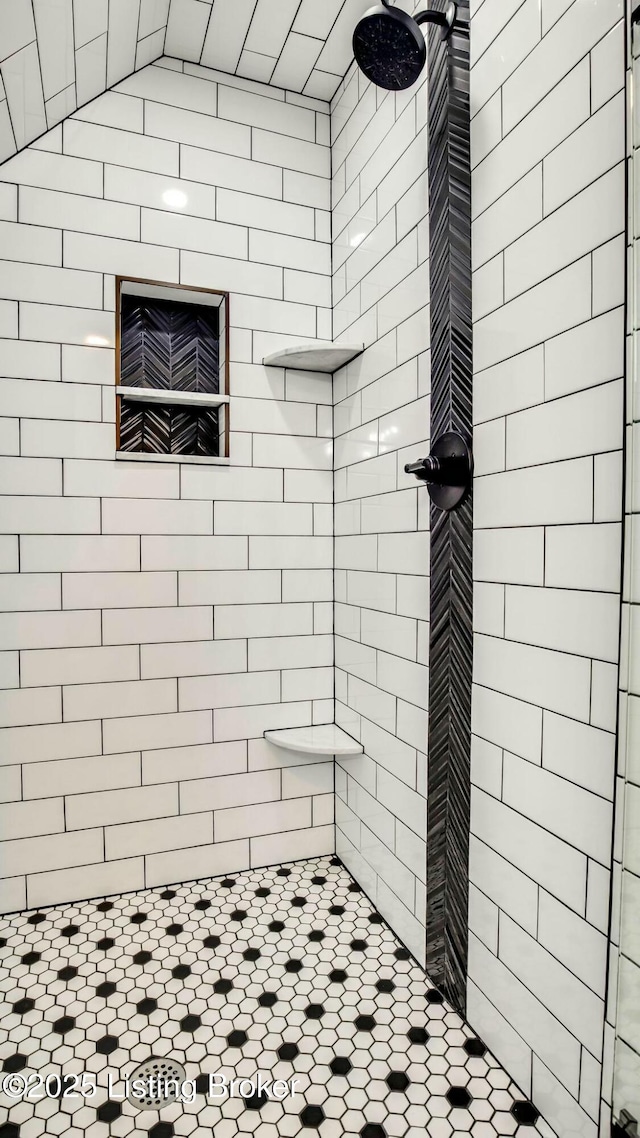 full bathroom with tiled shower