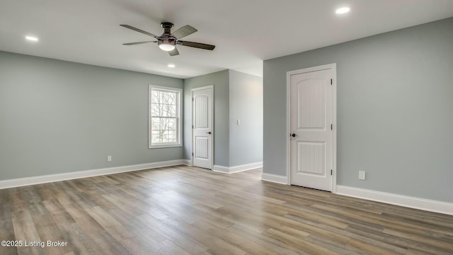 unfurnished bedroom featuring baseboards, a ceiling fan, wood finished floors, and recessed lighting