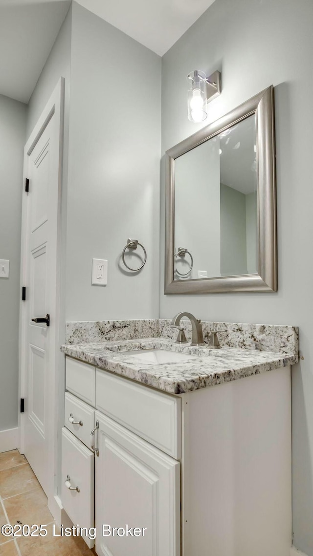 bathroom with baseboards and vanity