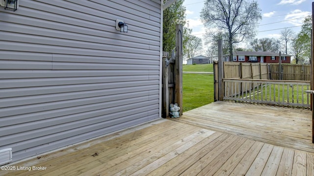 wooden terrace with a yard