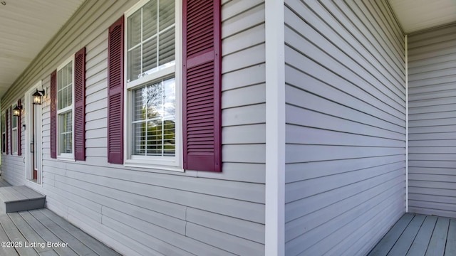 view of side of home with a porch