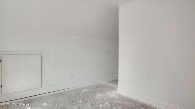 additional living space featuring baseboards