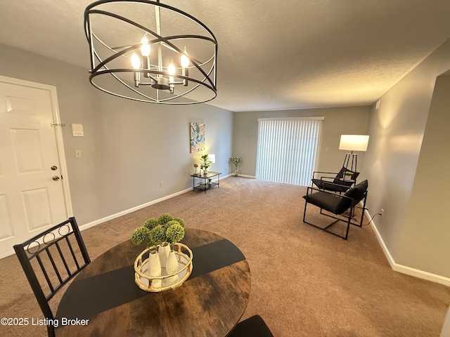 dining room featuring a textured ceiling, baseboards, a chandelier, and carpet
