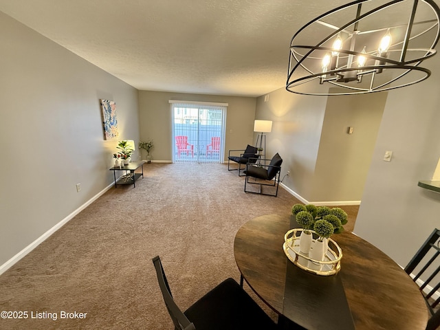 carpeted dining area featuring an inviting chandelier, baseboards, and a textured ceiling