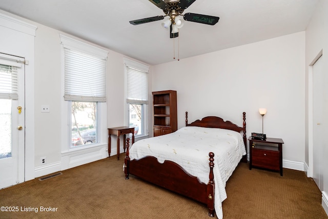 1035 Lydia St, Louisville, KY 40217 - bedroom featuring carpet floors, multiple windows, baseboards, and ceiling fan