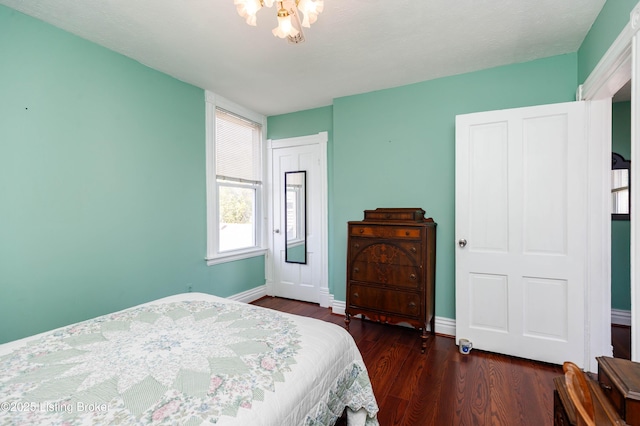 1035 Lydia St, Louisville, KY 40217 - bedroom featuring wood finished floors, baseboards, and a closet