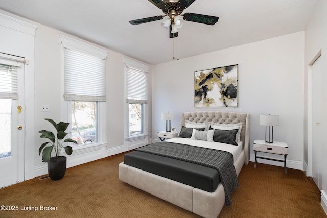 1035 Lydia St, Louisville, KY 40217 - carpeted bedroom with multiple windows, a ceiling fan, and baseboards