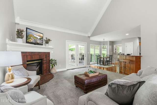 living area with carpet flooring, baseboards, high vaulted ceiling, french doors, and crown molding