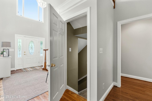 entrance foyer with wood finished floors and baseboards