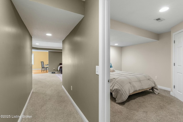 carpeted bedroom with recessed lighting, visible vents, and baseboards