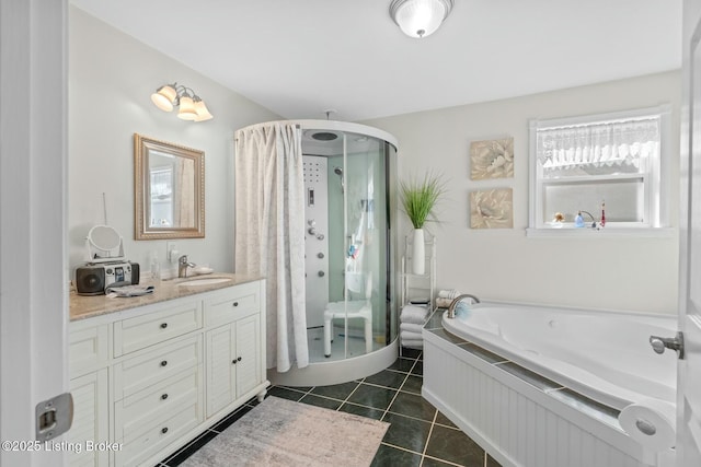 full bath featuring tile patterned floors, a stall shower, a garden tub, and vanity