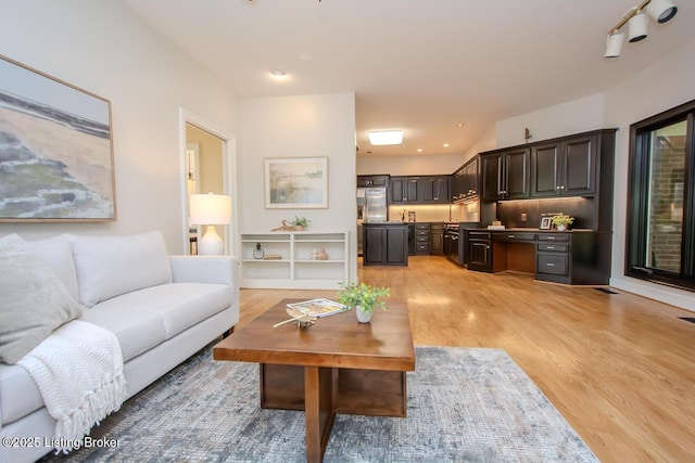 1038 Garden Creek Cir, Louisville, KY 40223 - living room featuring light wood finished floors and recessed lighting
