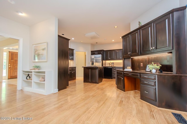1038 Garden Creek Cir, Louisville, KY 40223 - kitchen featuring stainless steel refrigerator with ice dispenser, a center island, light wood finished floors, dark brown cabinets, and recessed lighting
