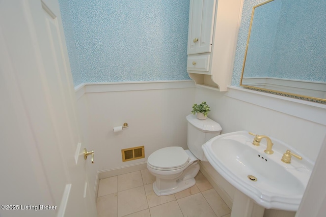 1038 Garden Creek Cir, Louisville, KY 40223 - half bathroom featuring toilet, a sink, and tile patterned flooring